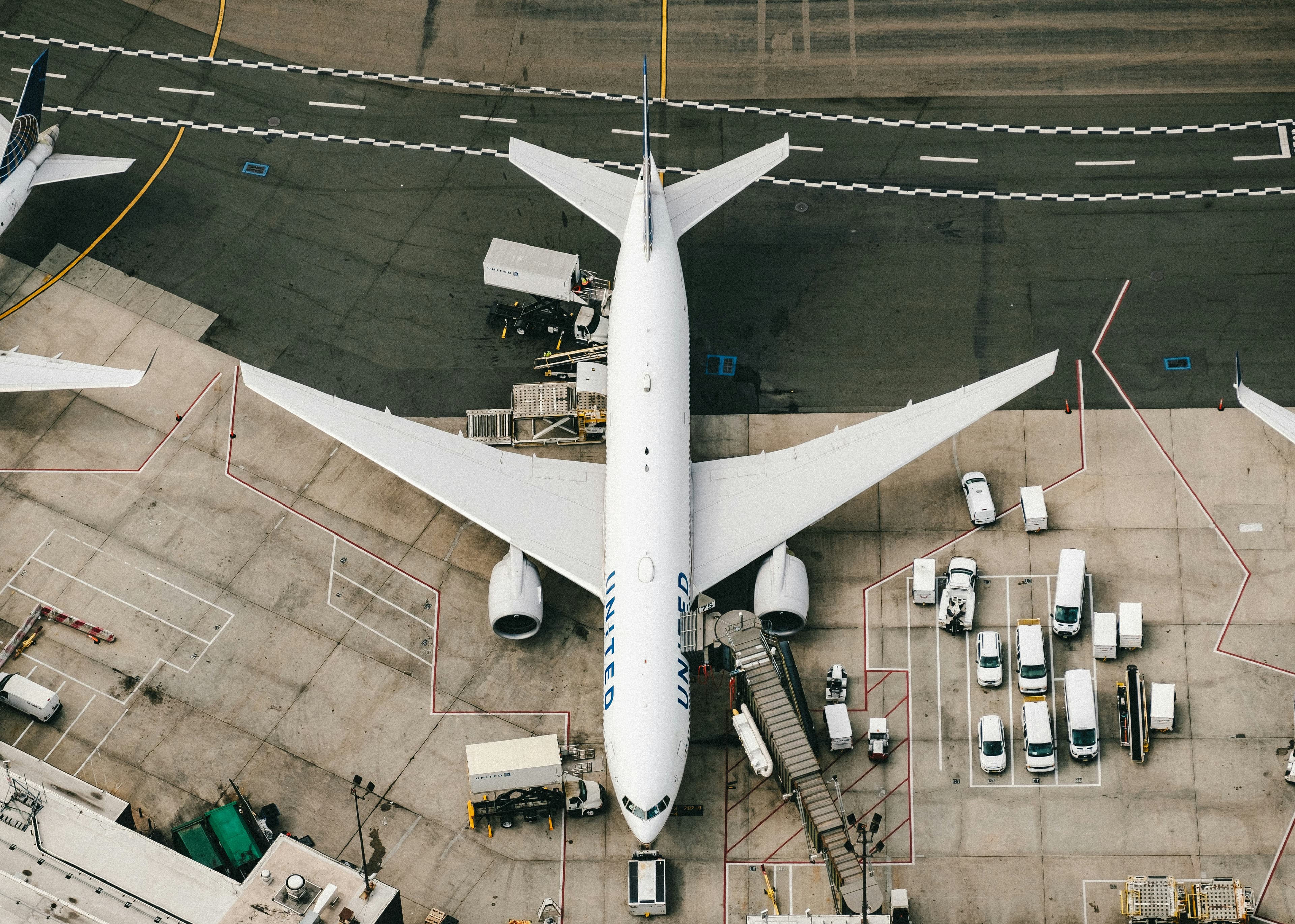 Aerial close-up of aircraft docked at terminal gate