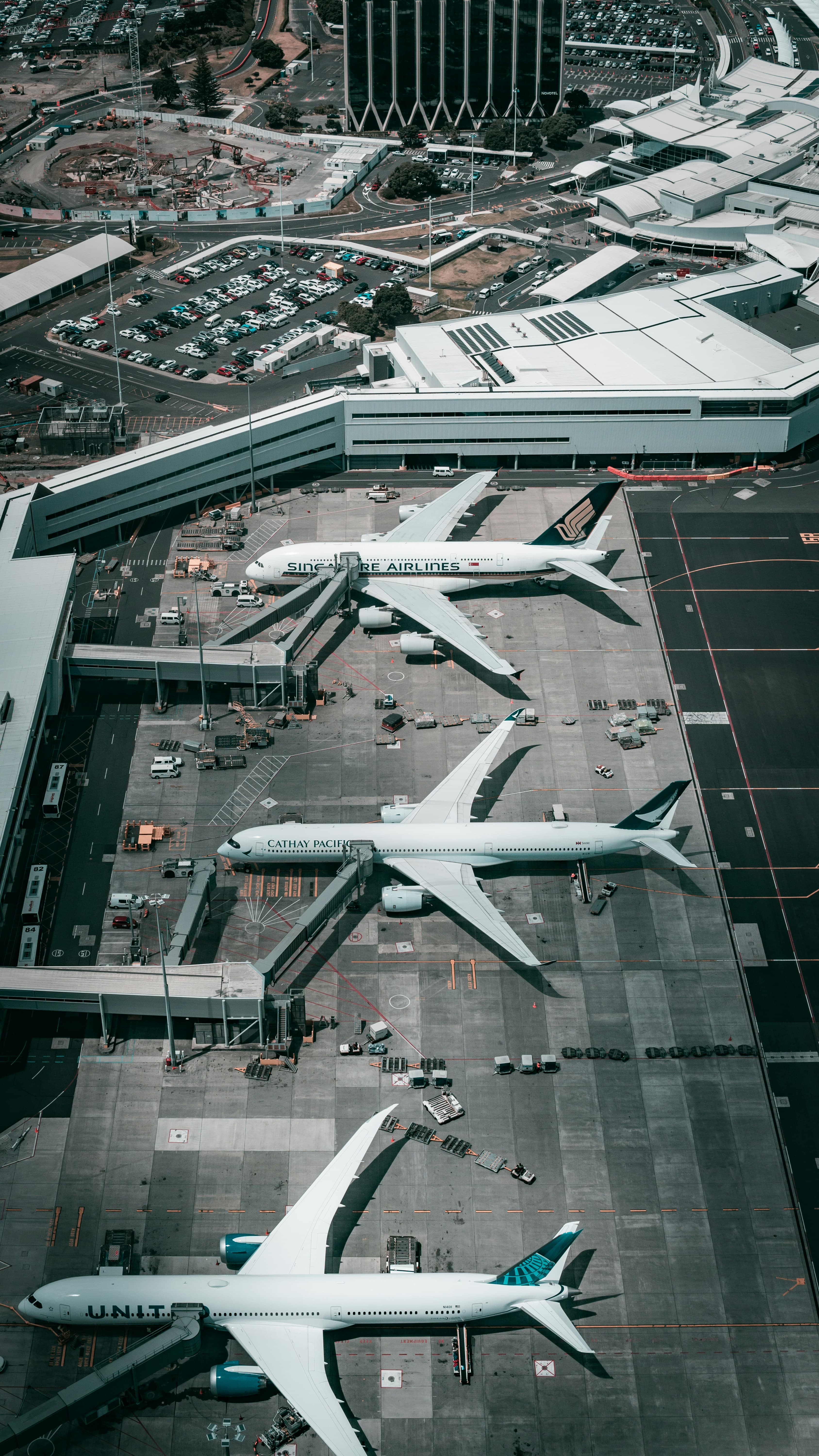 Aerial view of an airport apron with multiple aircraft at gates