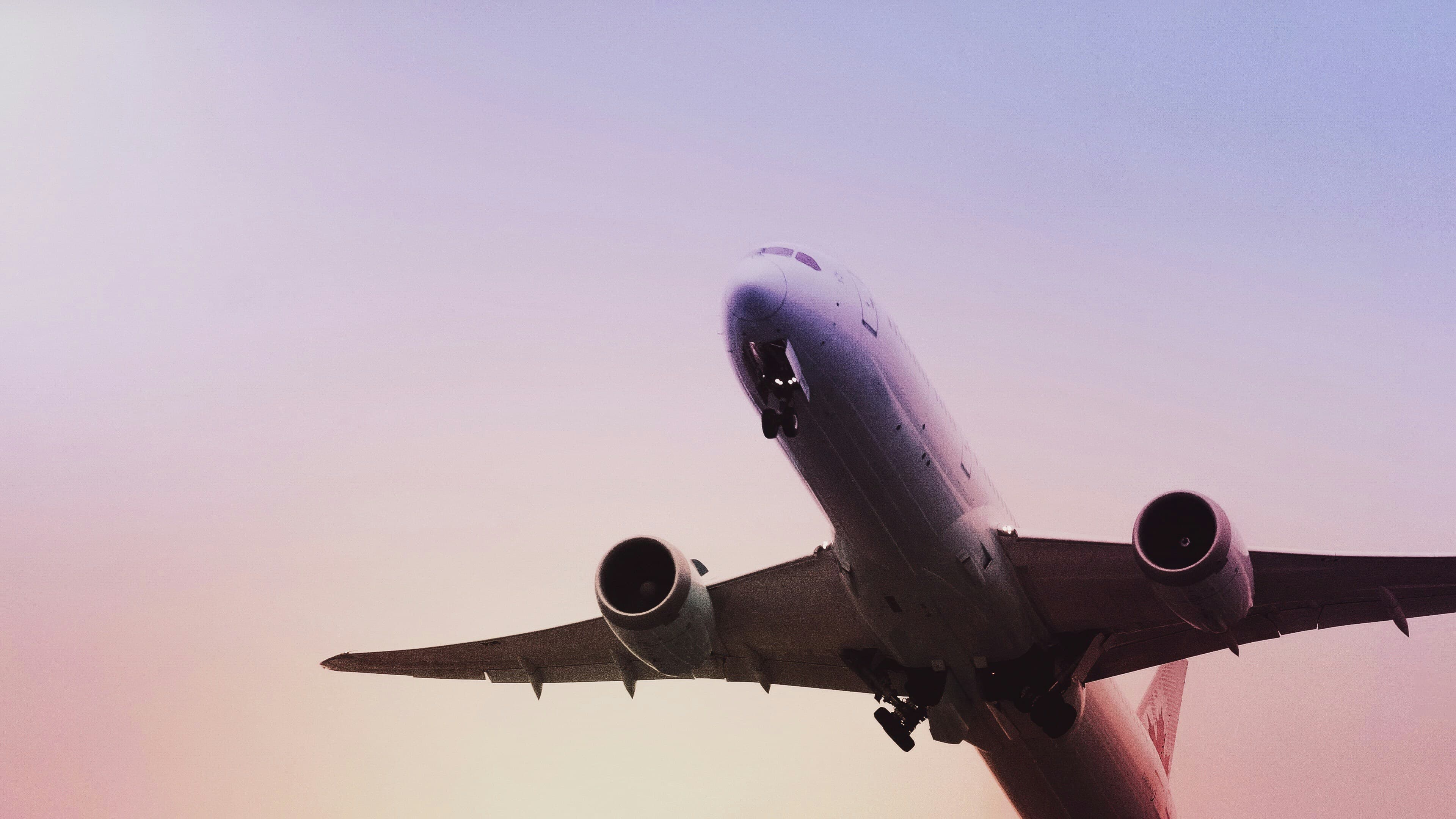 Aircraft ascending at sunset